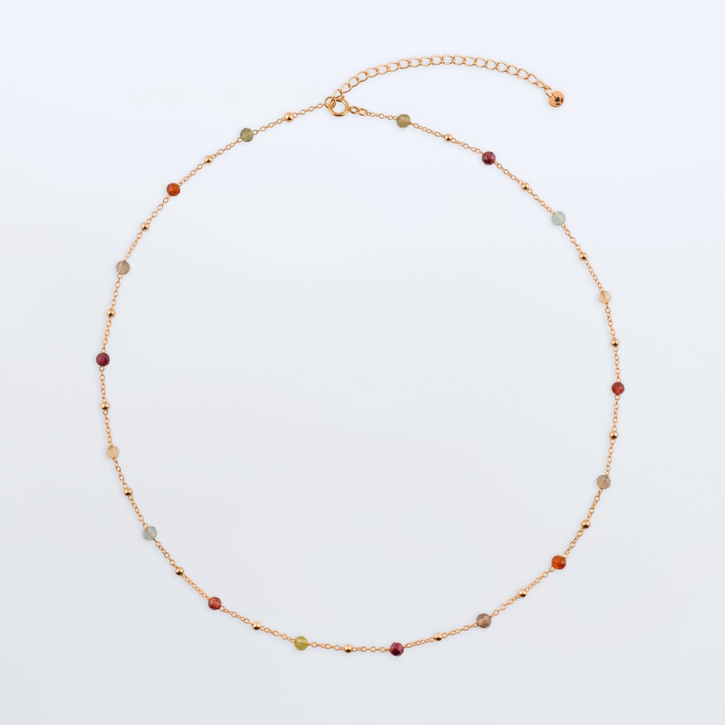 Estelle dainty high quality natural multi-colored gemstone beaded chain adjustable necklace 14K gold filled, top view laying flat on a plain white background. Featuring high quality AAA Apatite, Agate, Citrine, Garnet, Labradorite, Obsidian, Peridot gemstones.