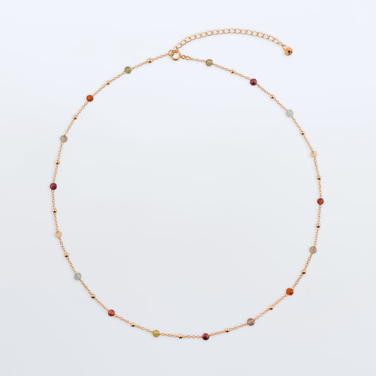Estelle dainty high quality natural multi-colored gemstone beaded chain adjustable necklace 14K gold filled, top view laying flat on a plain white background. Featuring high quality AAA Apatite, Agate, Citrine, Garnet, Labradorite, Obsidian, Peridot gemstones.
