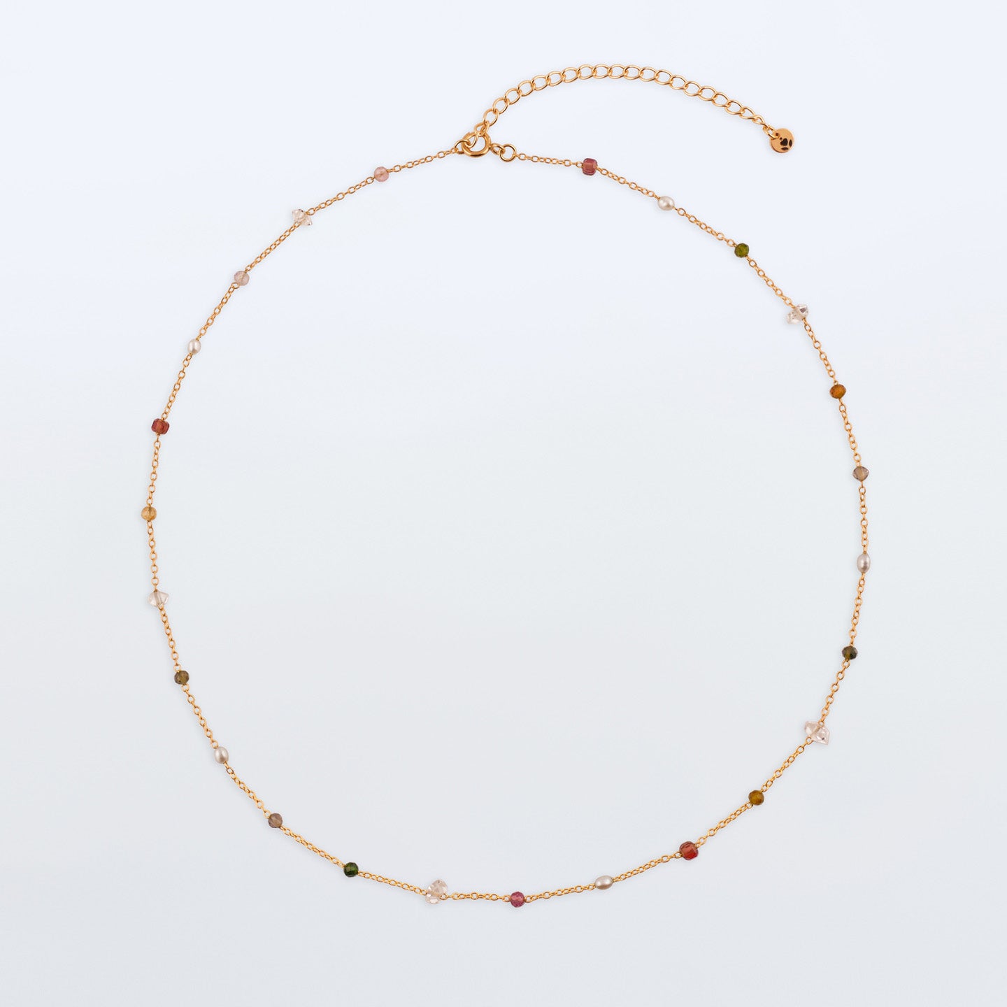 Lenora high quality natural multi-colored gemstone beaded chain adjustable necklace 14K gold filled, top view with plain background. Featuring high quality AAA Herkimer Diamond Quartz, Garnet, Rainbow Tourmaline, Natural Freshwater Rice Pearls and Smokey Quartz gemstones.